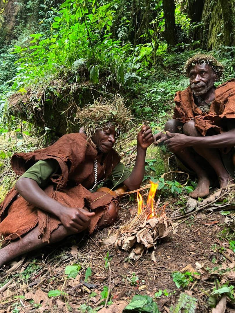 Batwa elder making fire